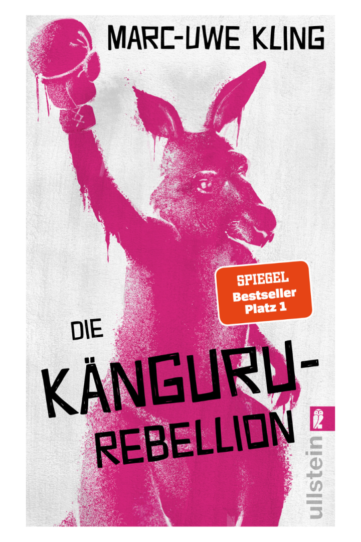 Das Cover von Marc-Uwe Klings Buch „Die Känguru-Rebellion“ zeigt ein pinkes Känguru mit erhobener Faust und Boxhandschuh, ausgezeichnet als Spiegel-Bestseller.