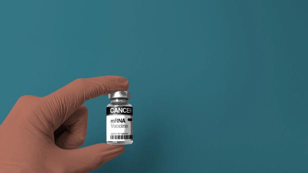 mRNA Vaccine Vial For Cancer Immunotherapy On Blue Background