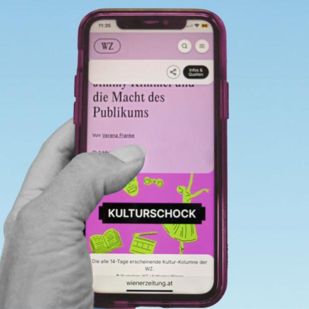 Eine Hand hält ein Handy, auf dem die Website der neuen Wiener Zeitung geöffnet ist