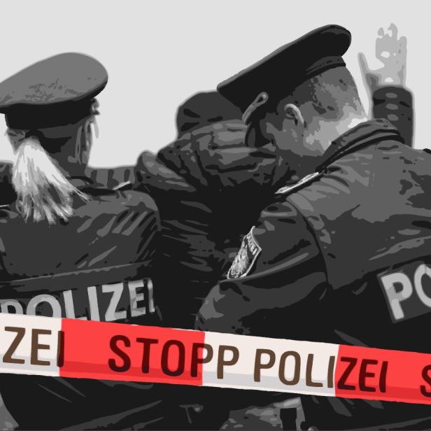 Zwei Polizisten bei einer Festnahme